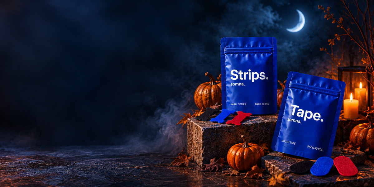 Somna Strips and Tape pouches on a stone ledge with pumpkins under a crescent moon
